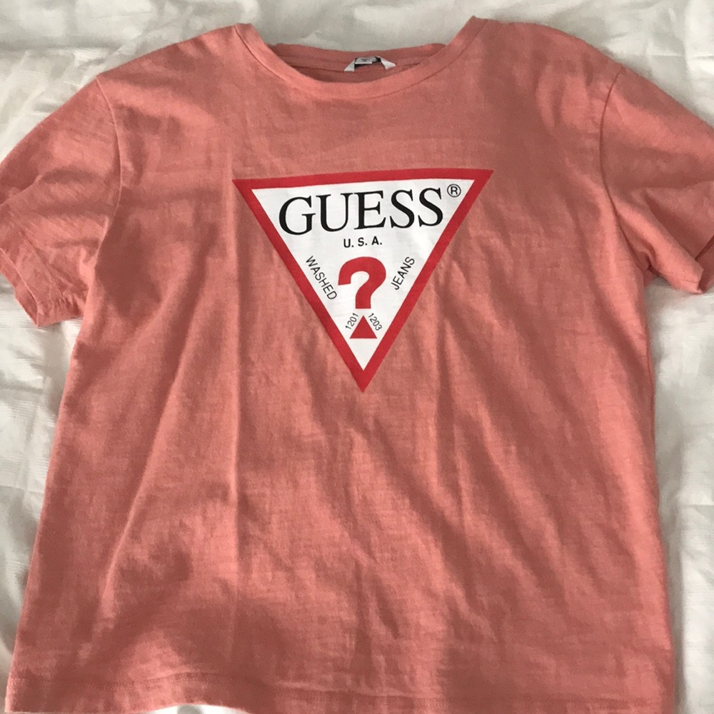 A salmon pink Guess shirt